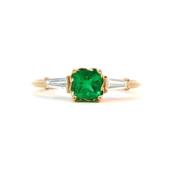 Emerald and tapered diamond ring