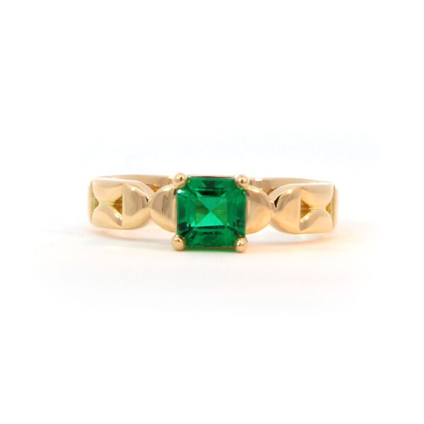 Emerald and gold ring